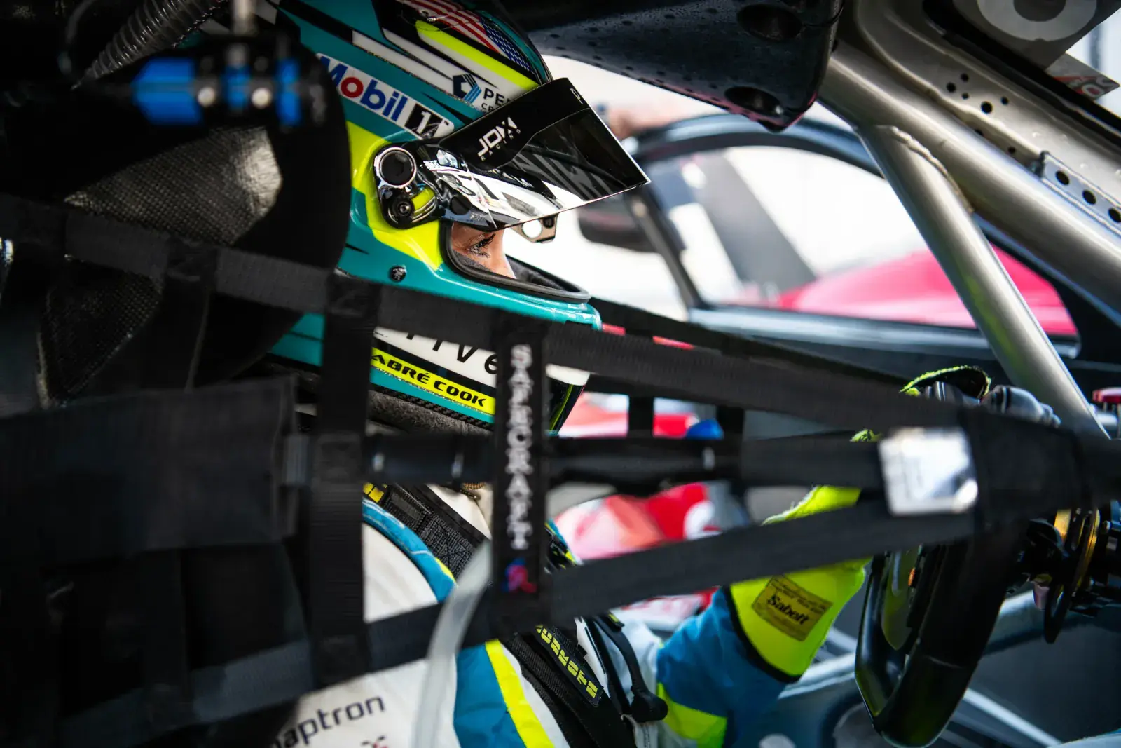 Sabré Cook inside of her Porsche 911 GT3 Cup car at the PMNA Indianapolis 2025 race weekend.